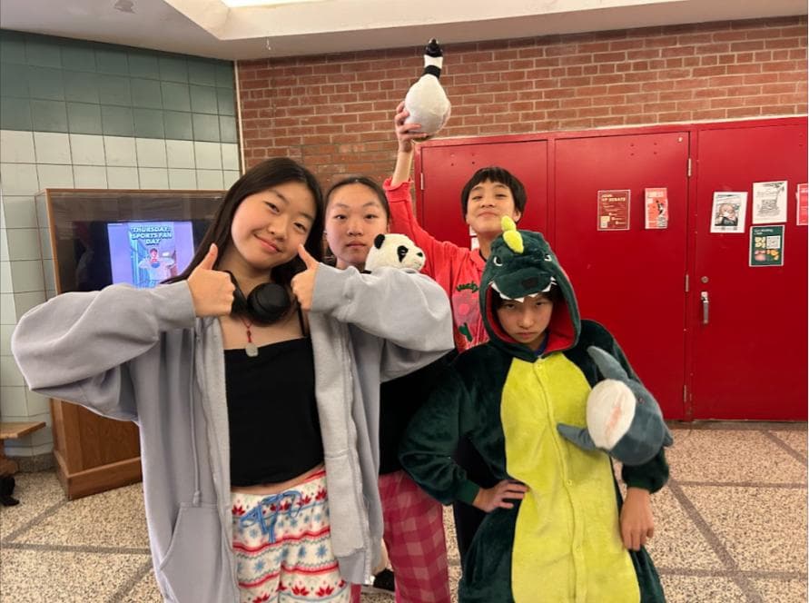 Four students wearing pajamas for Movie Day